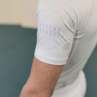 Rashguard Manto Shield manga curta Branco-Combat Arena